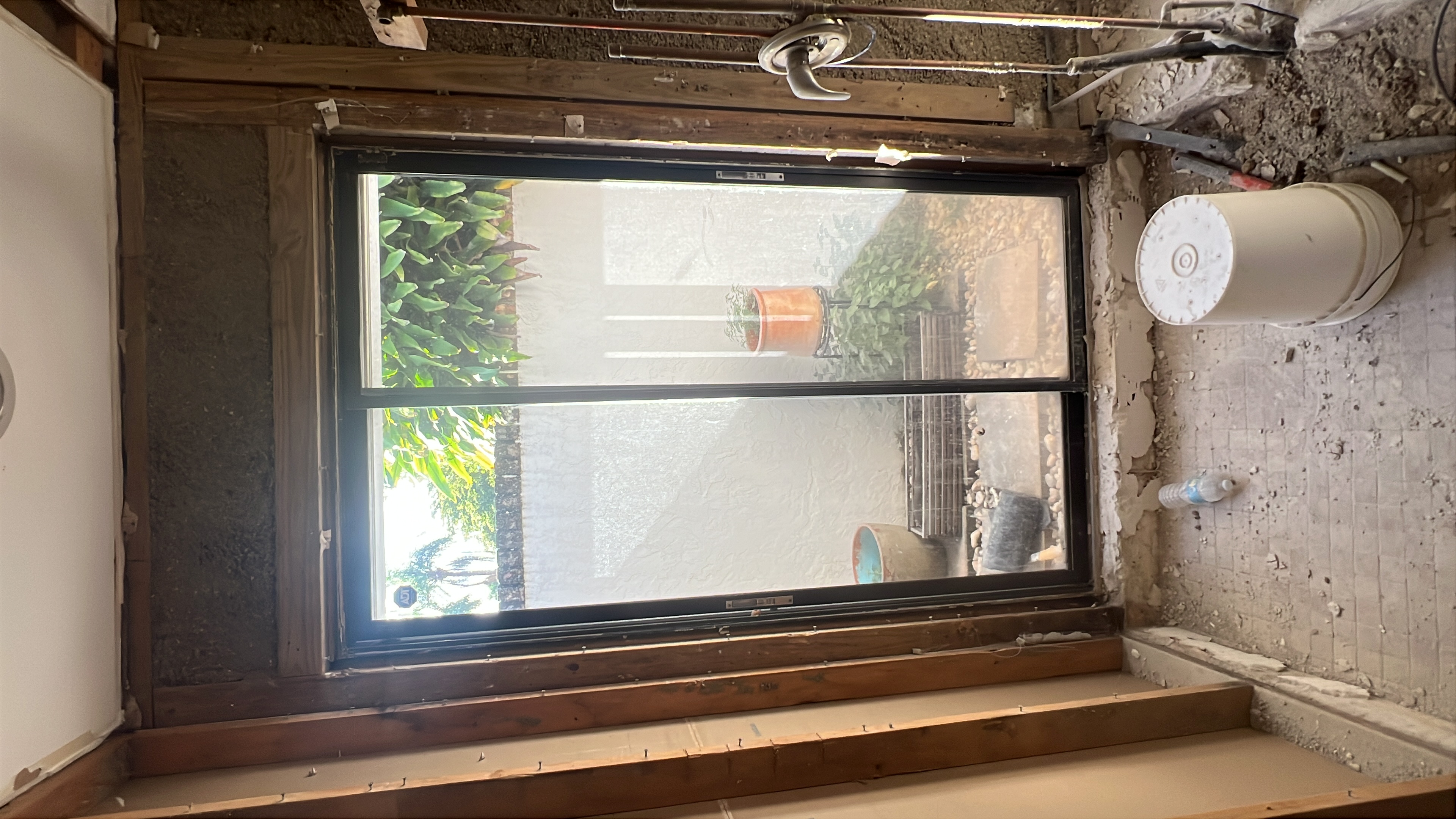 Sliding door opening under repair inside a coastal home